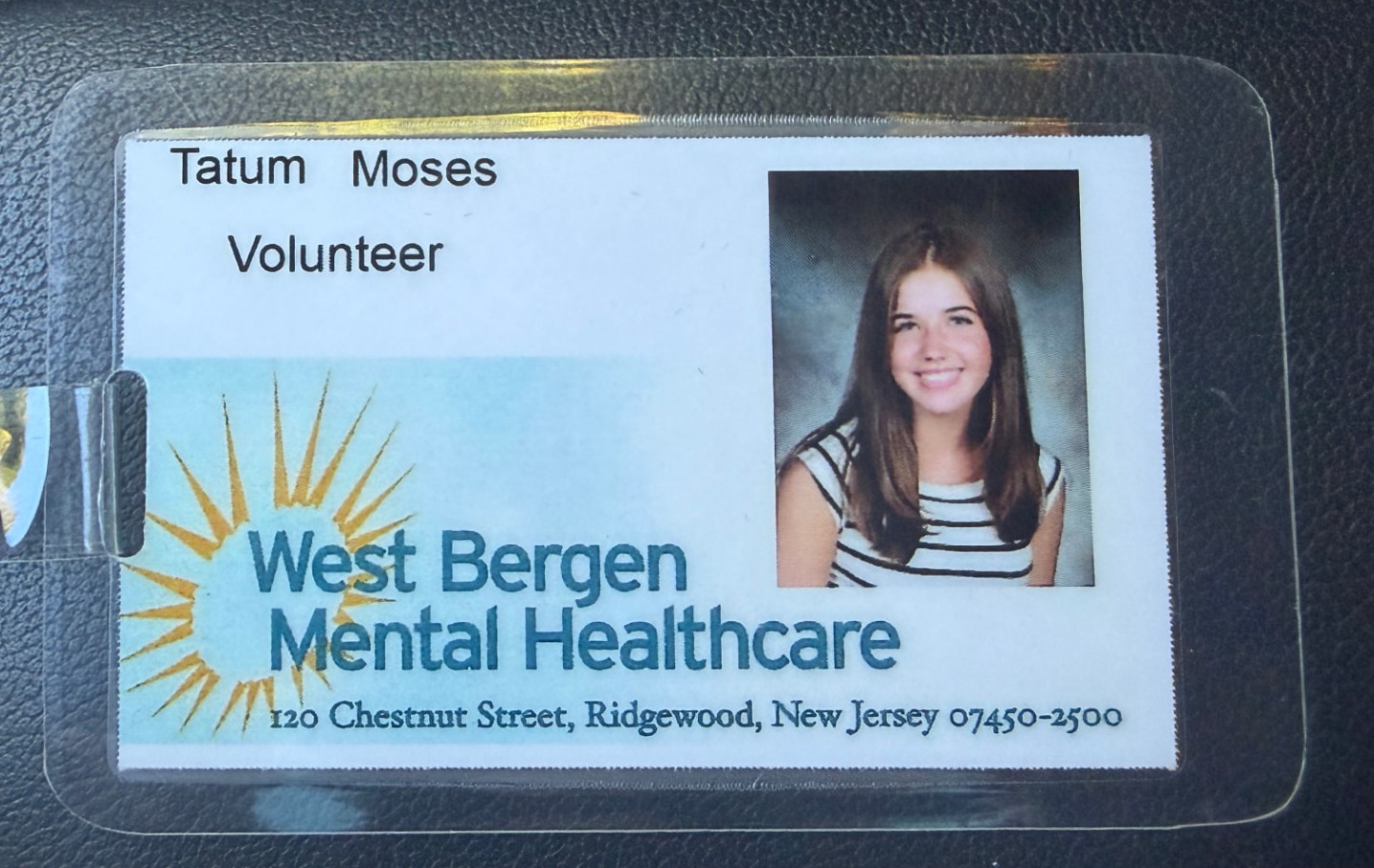 Tatum's West Bergen Mental Healthcare volunteer badge with her photo on it